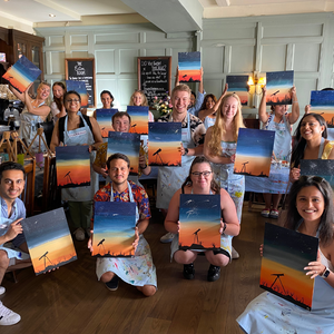 group of friends holding telescope paintings