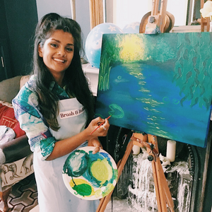 Artist posing with acrylic water painting