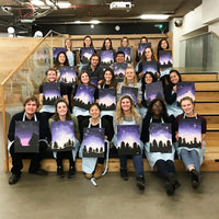 office employees posing with their acrylic paintings